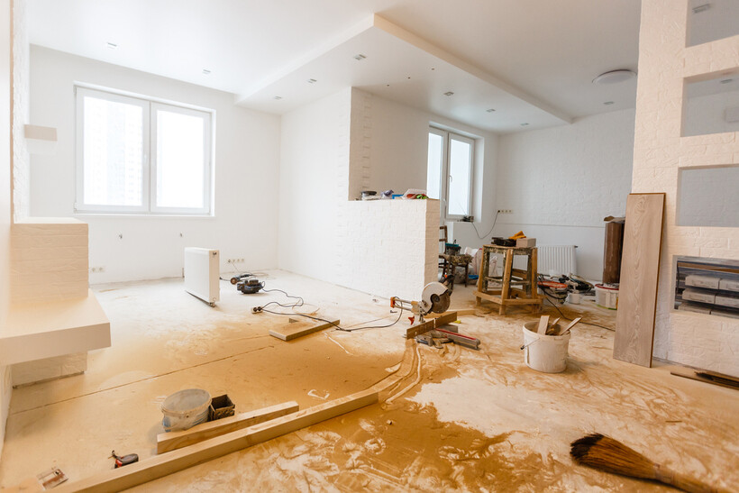 Interior of a residential property mid-renovation with wall repair and construction dust. - after builders cleaning