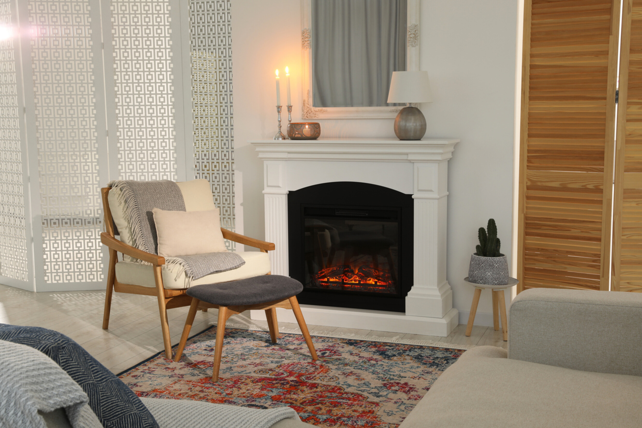 Warm interior design featuring a fireplace as the living room’s centrepiece.