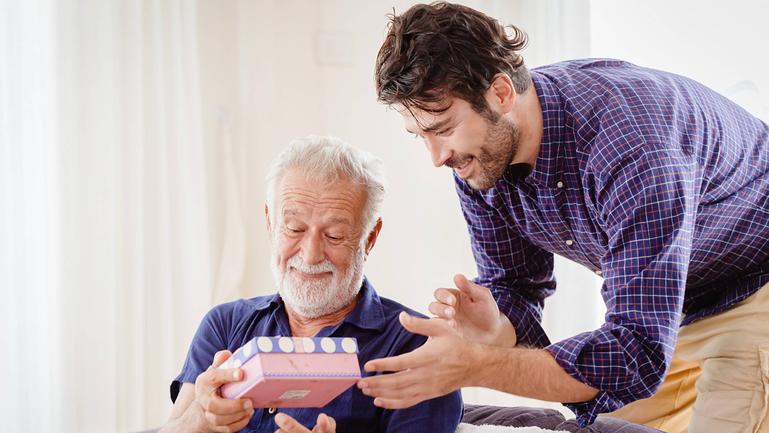 man giving something to his dad for Father's Day
