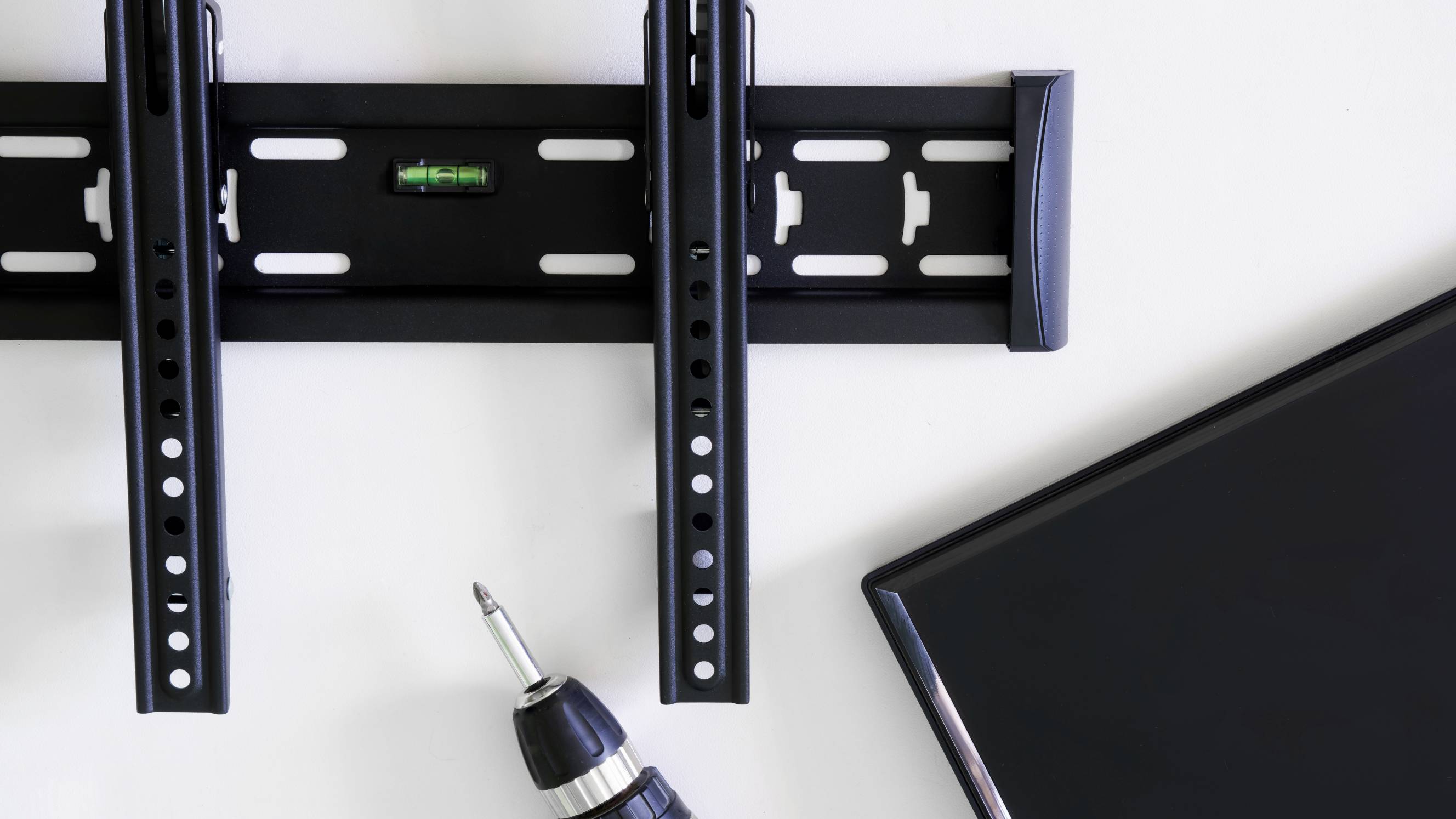 the process of wall mounting a TV