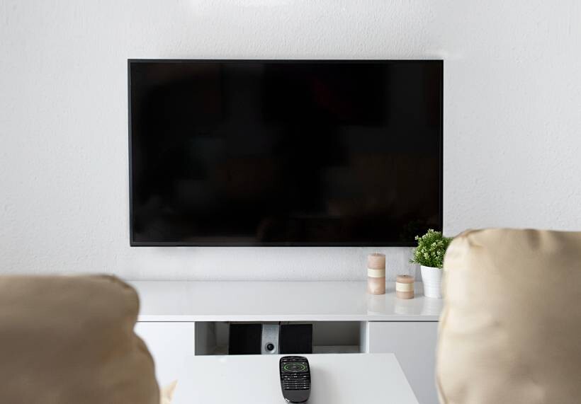 how much does it cost to wall mount a tv - Modern flat-screen TV mounted above a white media console