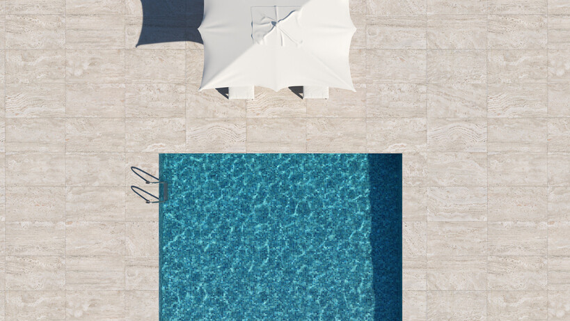 Top-down shot of a rectangular pool surrounded by large neutral-toned outdoor tiles. - can you tile over pebblecrete