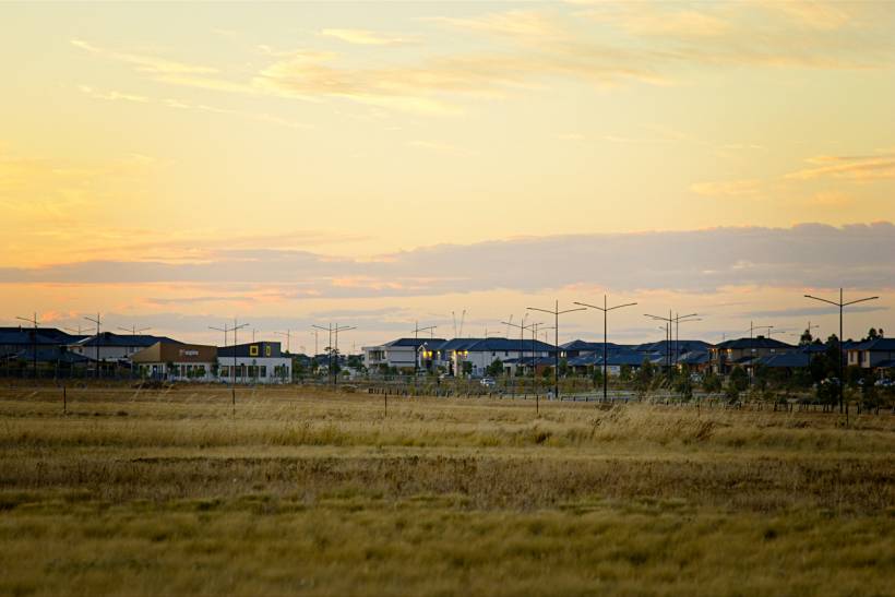 land survey cost - Vacant lot beside suburban residential development