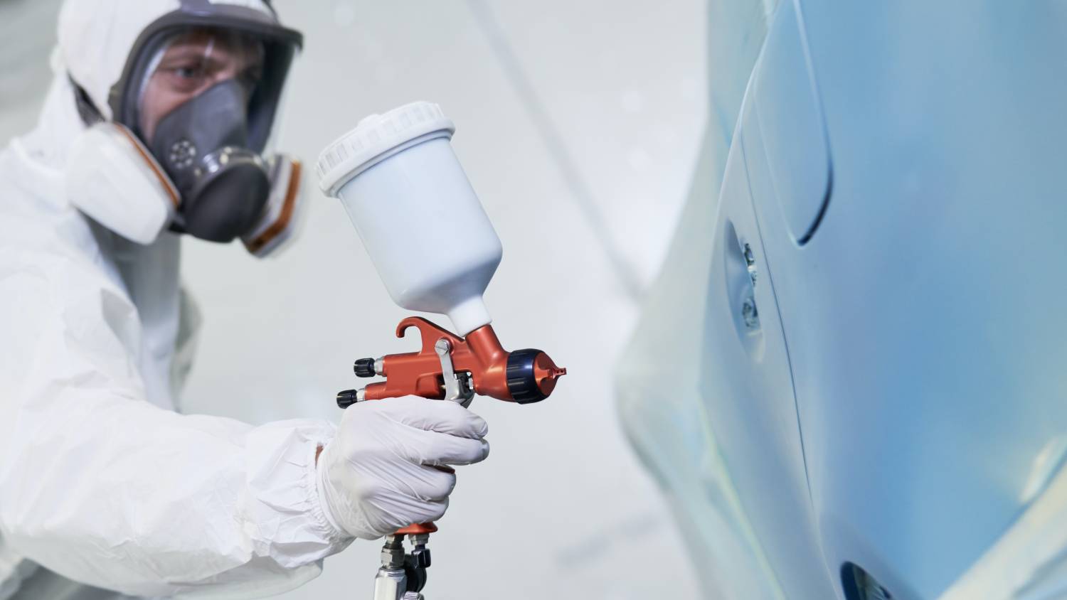 a specialist respraying a car