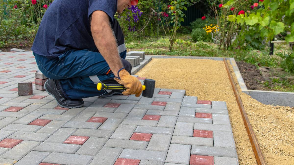 a man building a patio