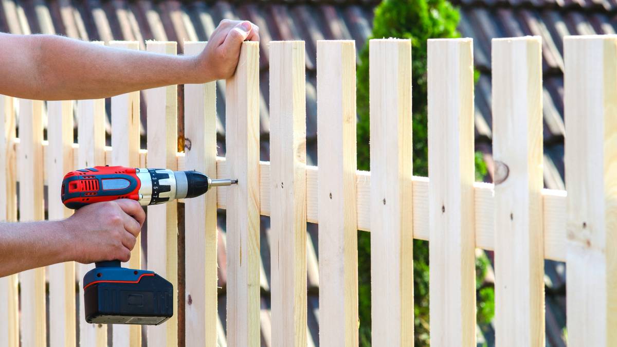 drilling wooden fence for repairs