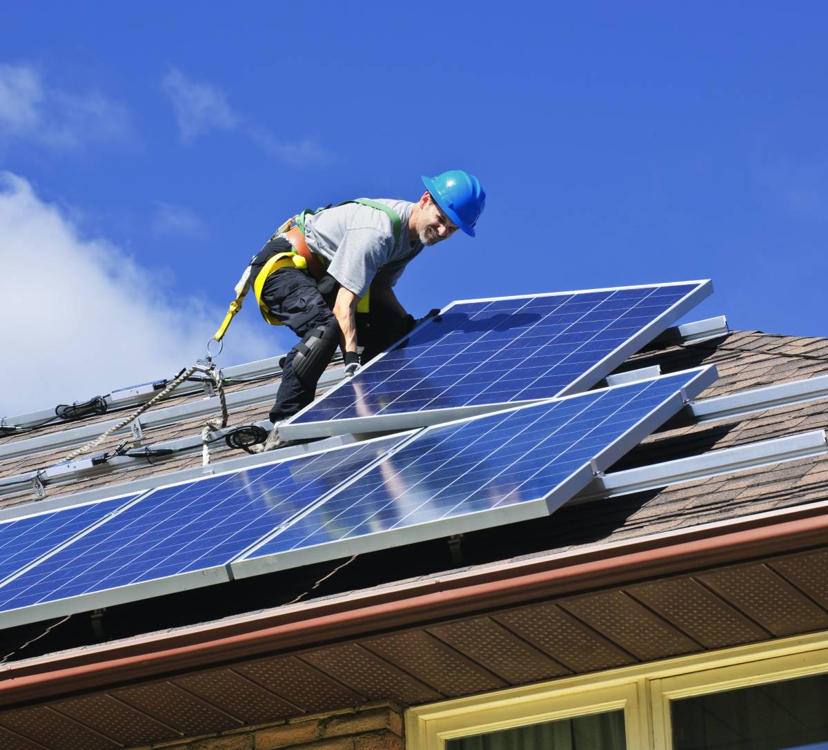 an electrician installing solar panels