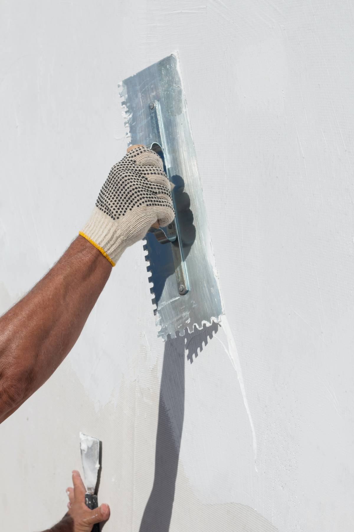 guy plastering a wall