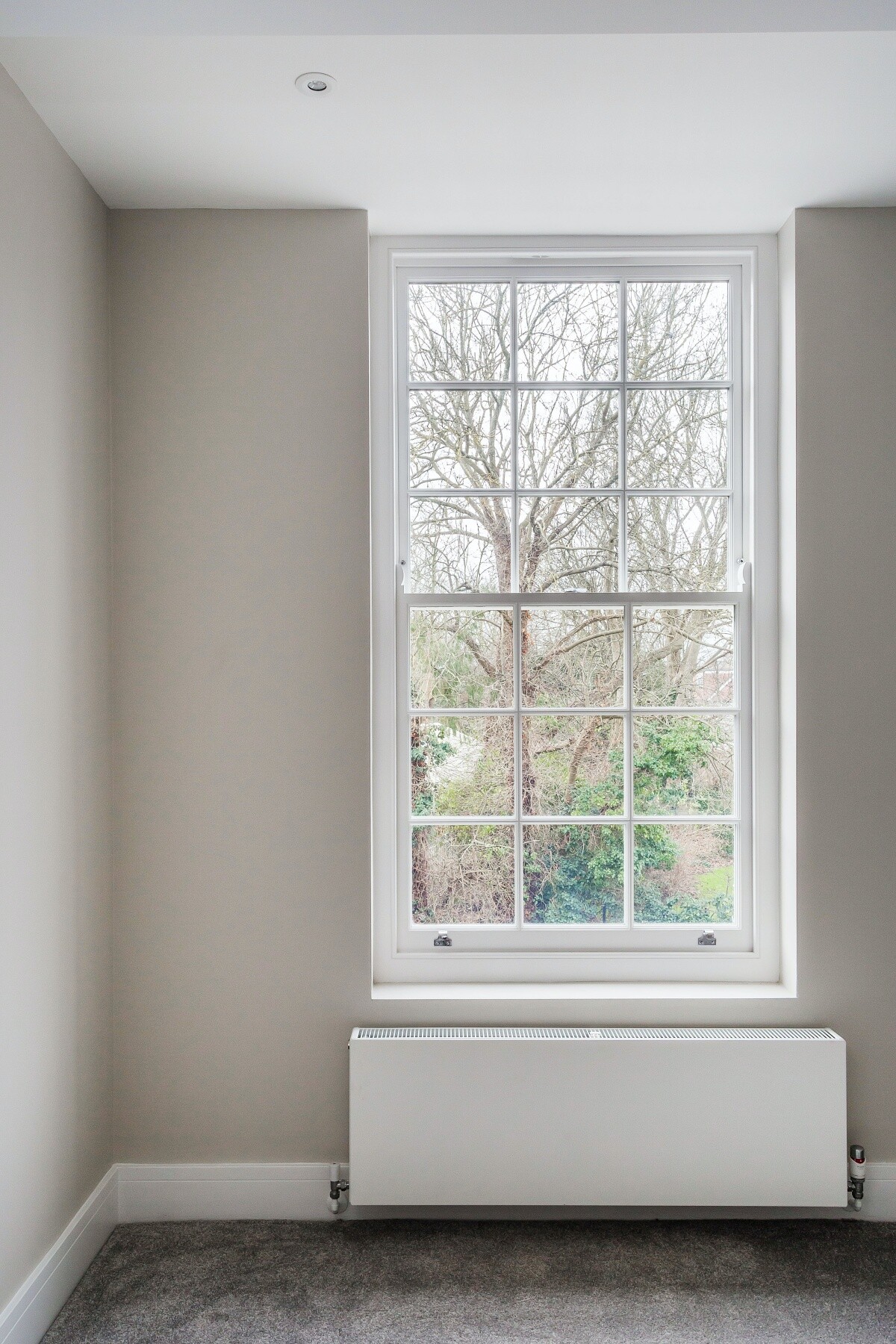 white sash window in bedroom