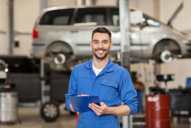 happy smiling auto mechanic man