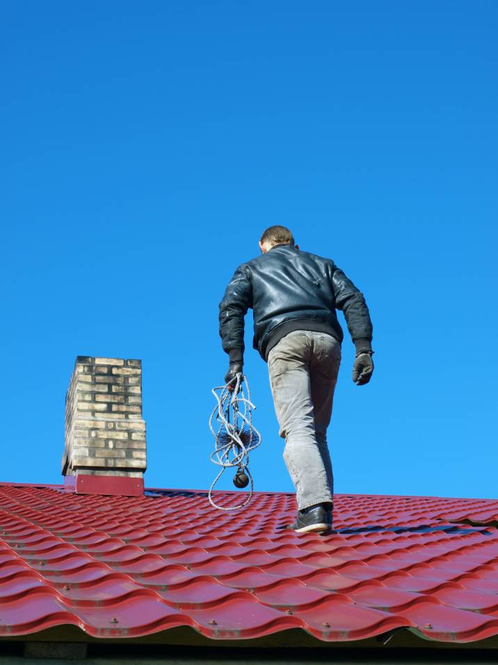 a man about to clean a chimney