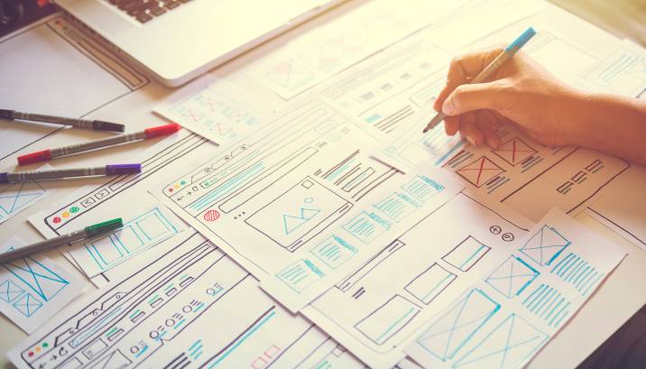 website designer planning drawing wireframe, planning website layout 