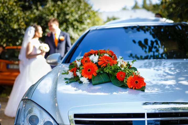 luxury wedding car decorated with flowers