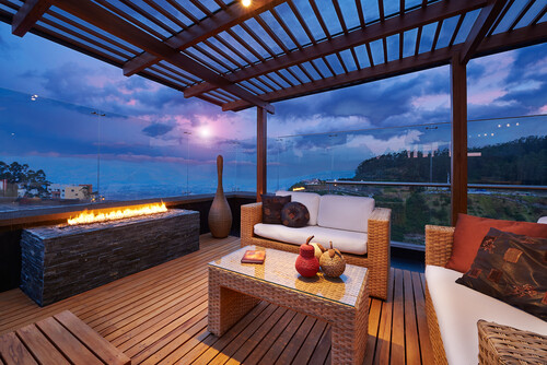 cozy patio facing the sunset beach well lit with fireplace planter box