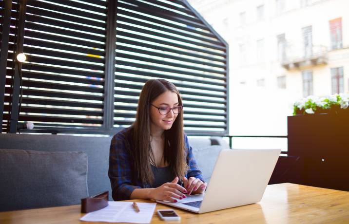 person writer in her laptop