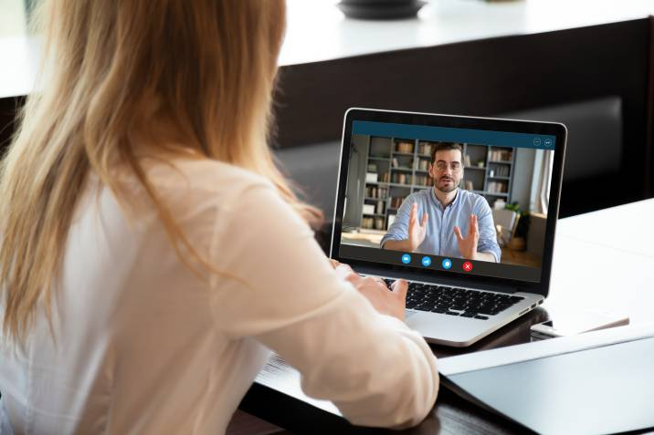 student listening to an online course