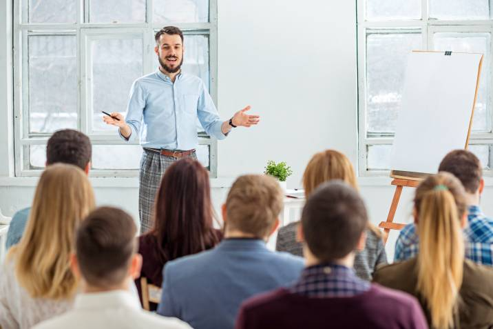 public speaker in front of a crowd