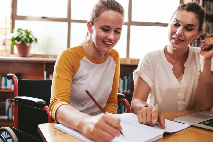 student working with her tutor