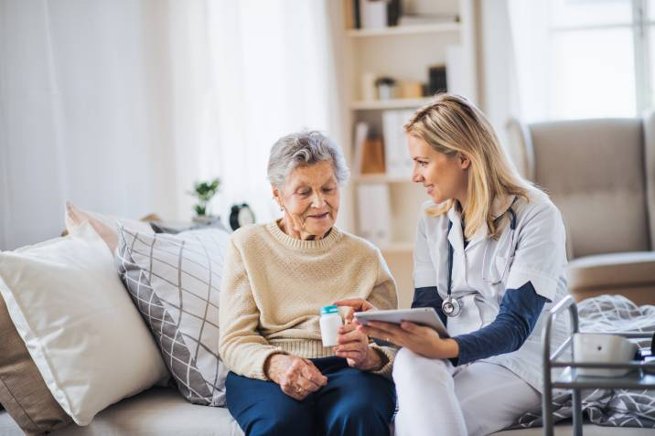 caregiver conversing with her patient