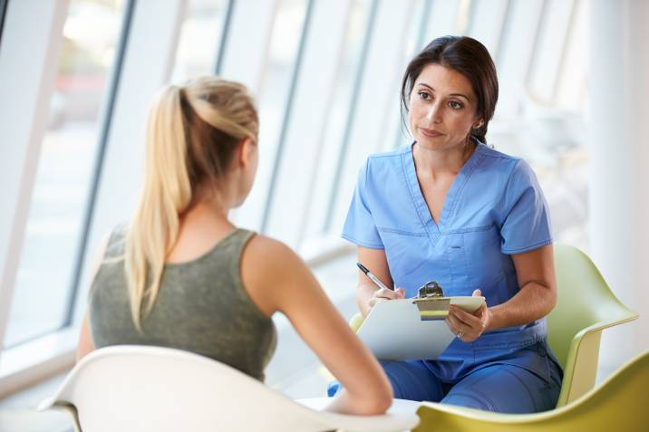 nurse discussing options with a patient