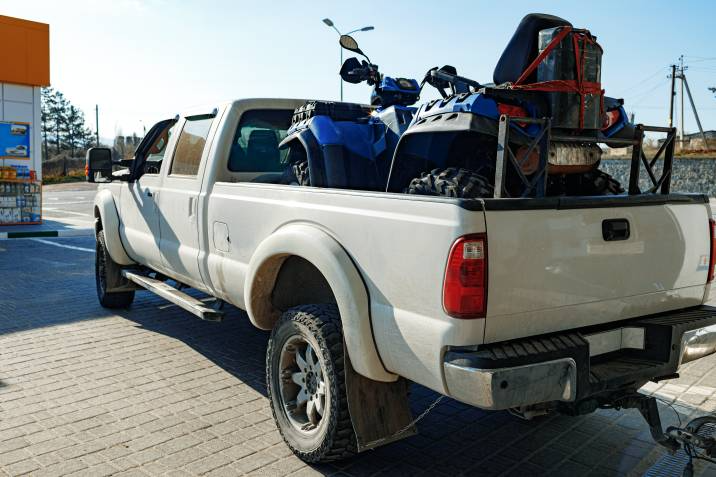 ATV loaded onto a pickup truck for towing