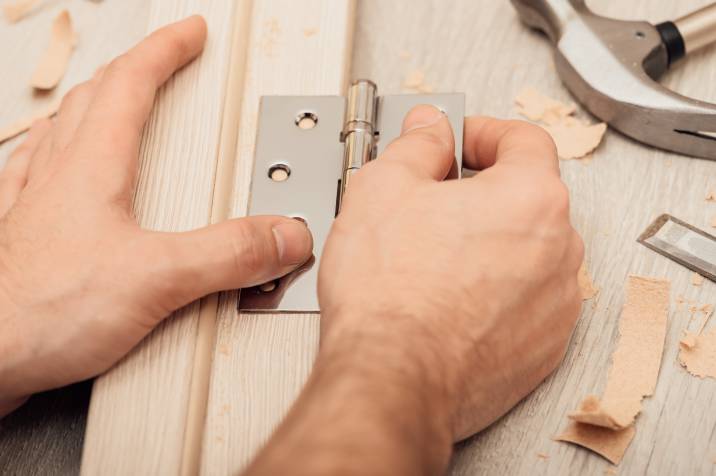 installing hinge brackets to a door frame