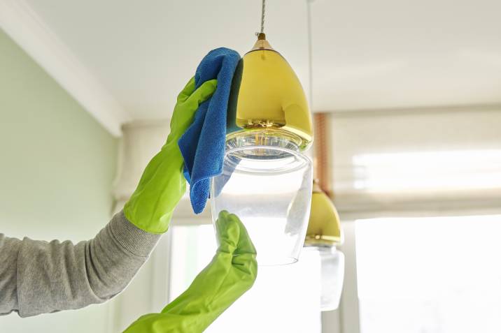 cleaning glass light fixture with rag