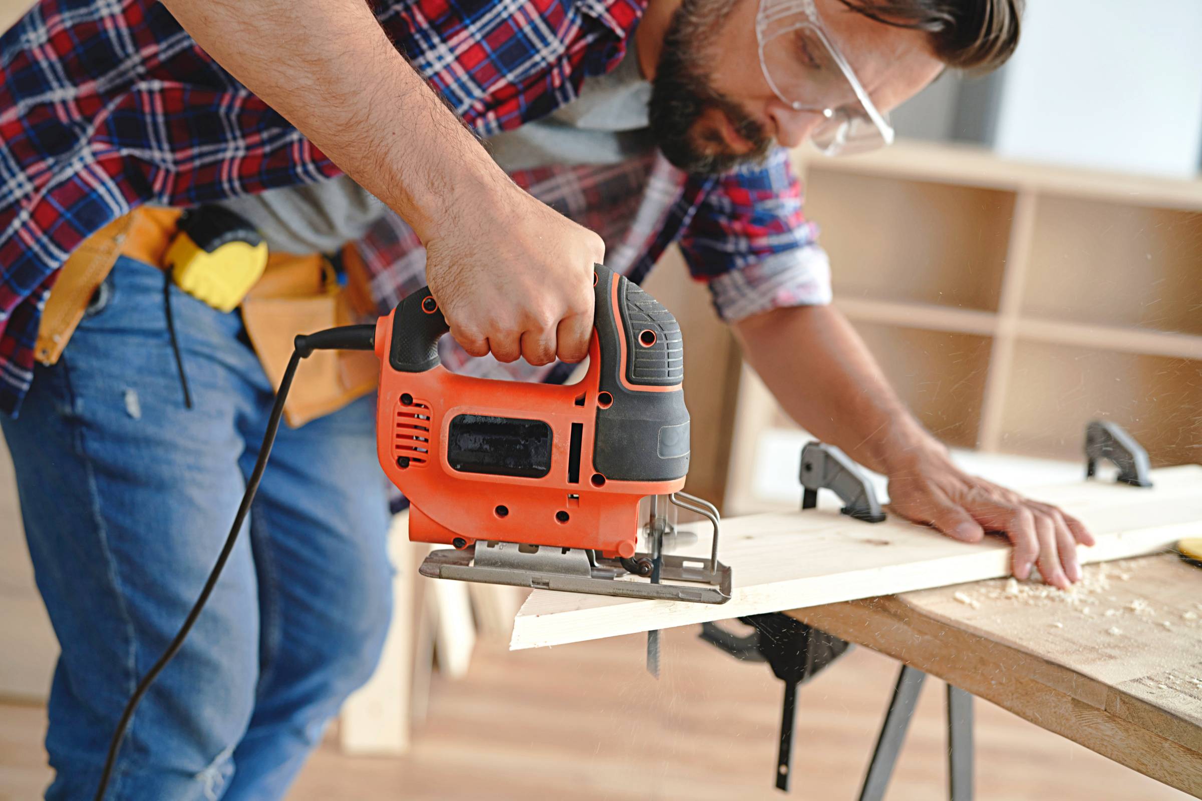 a carpenter using a power tool