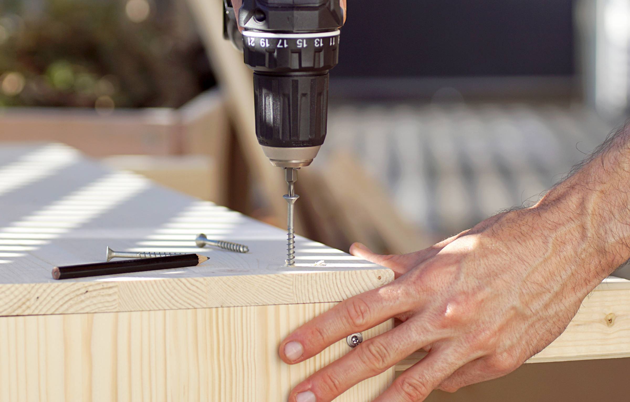 a joiner using a screwdriver