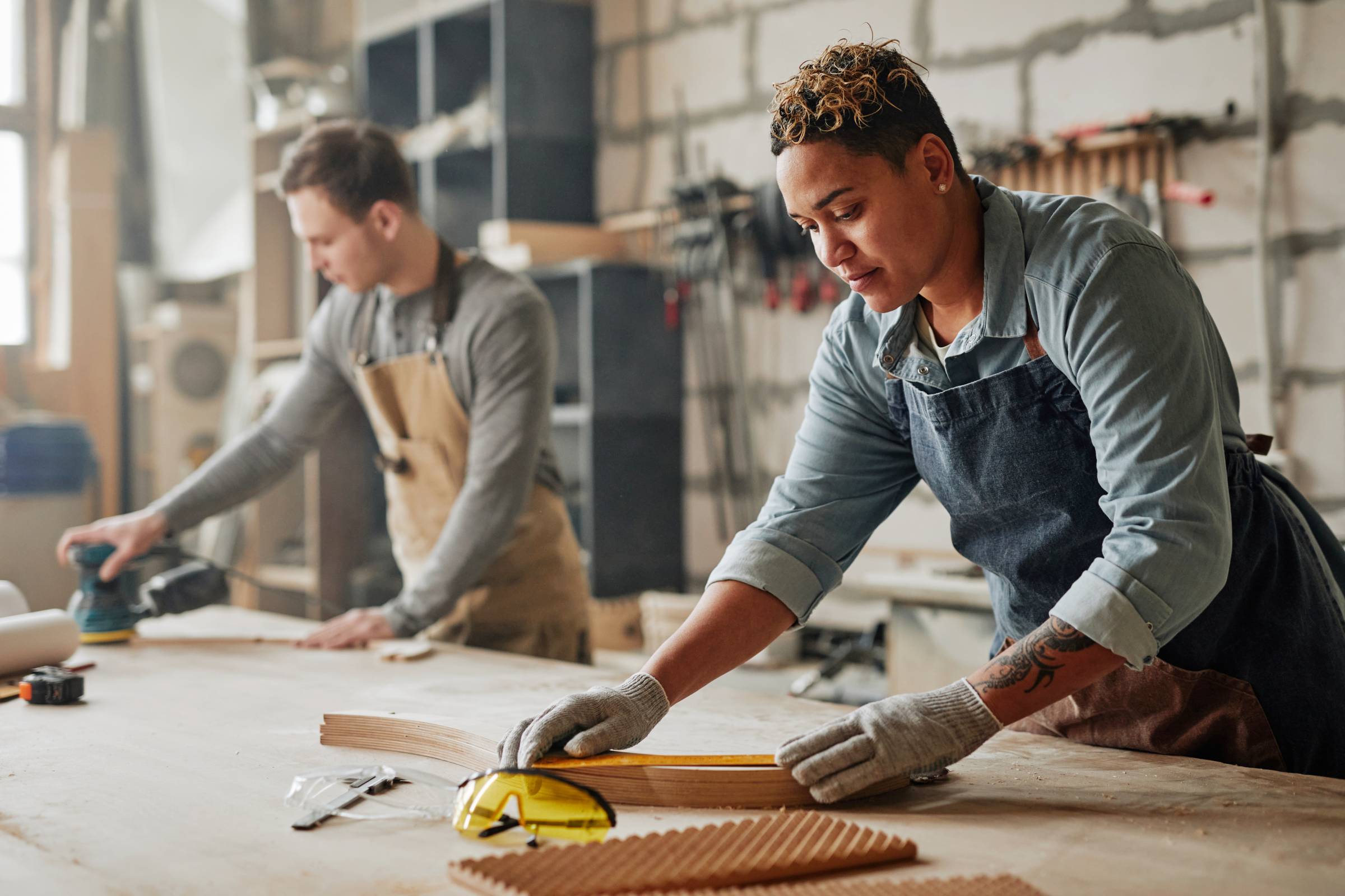 two artisans in a carpentry workshop