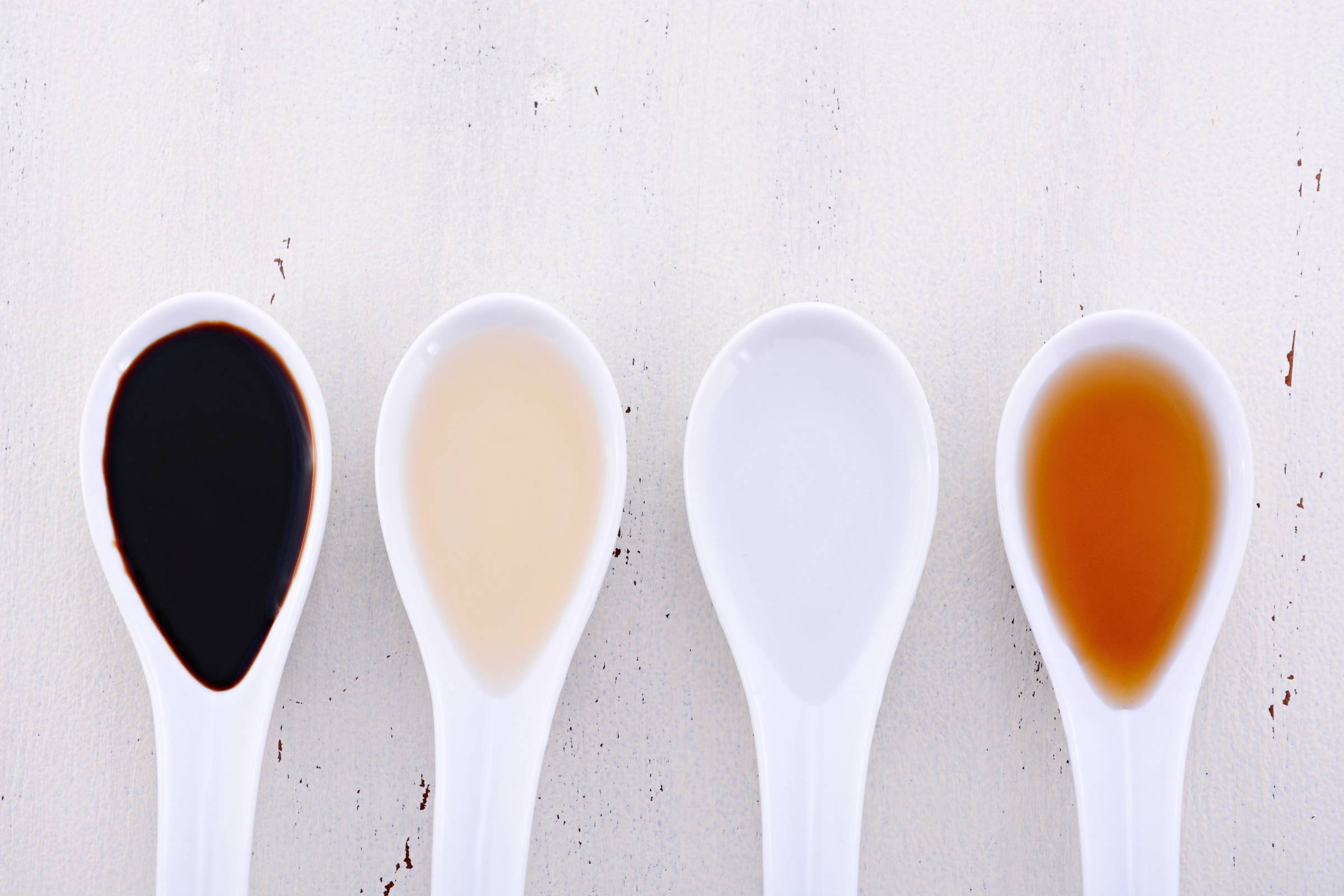 spoons full of different kinds of vinegar