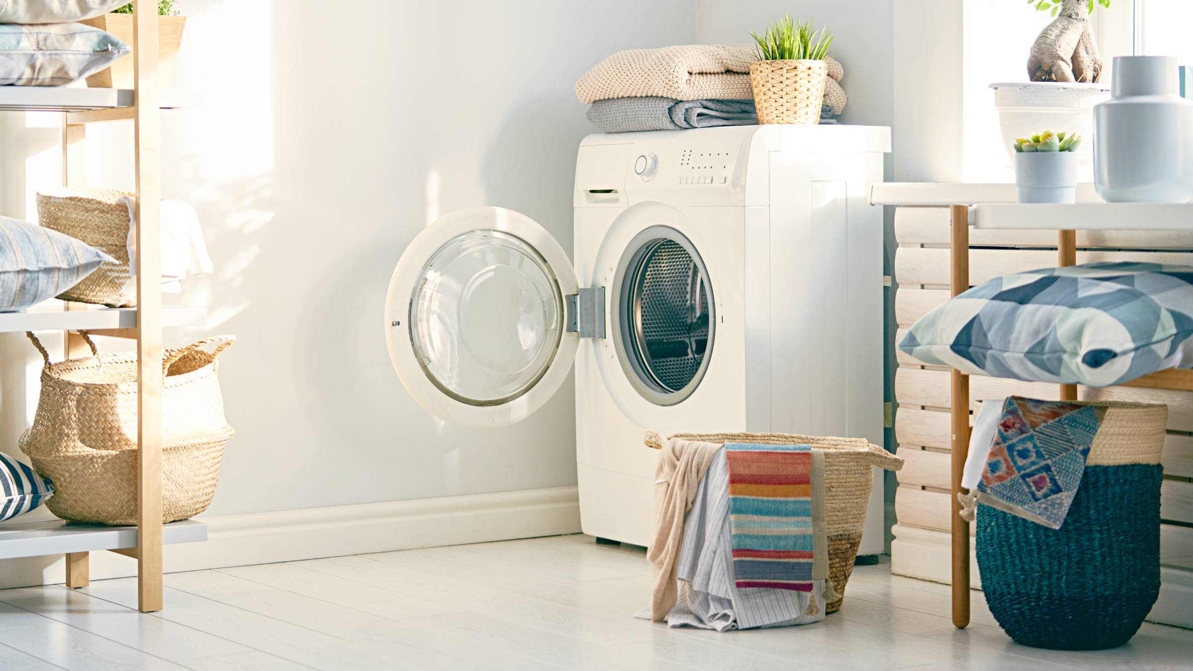 a laundry room with a front-load washing machine
