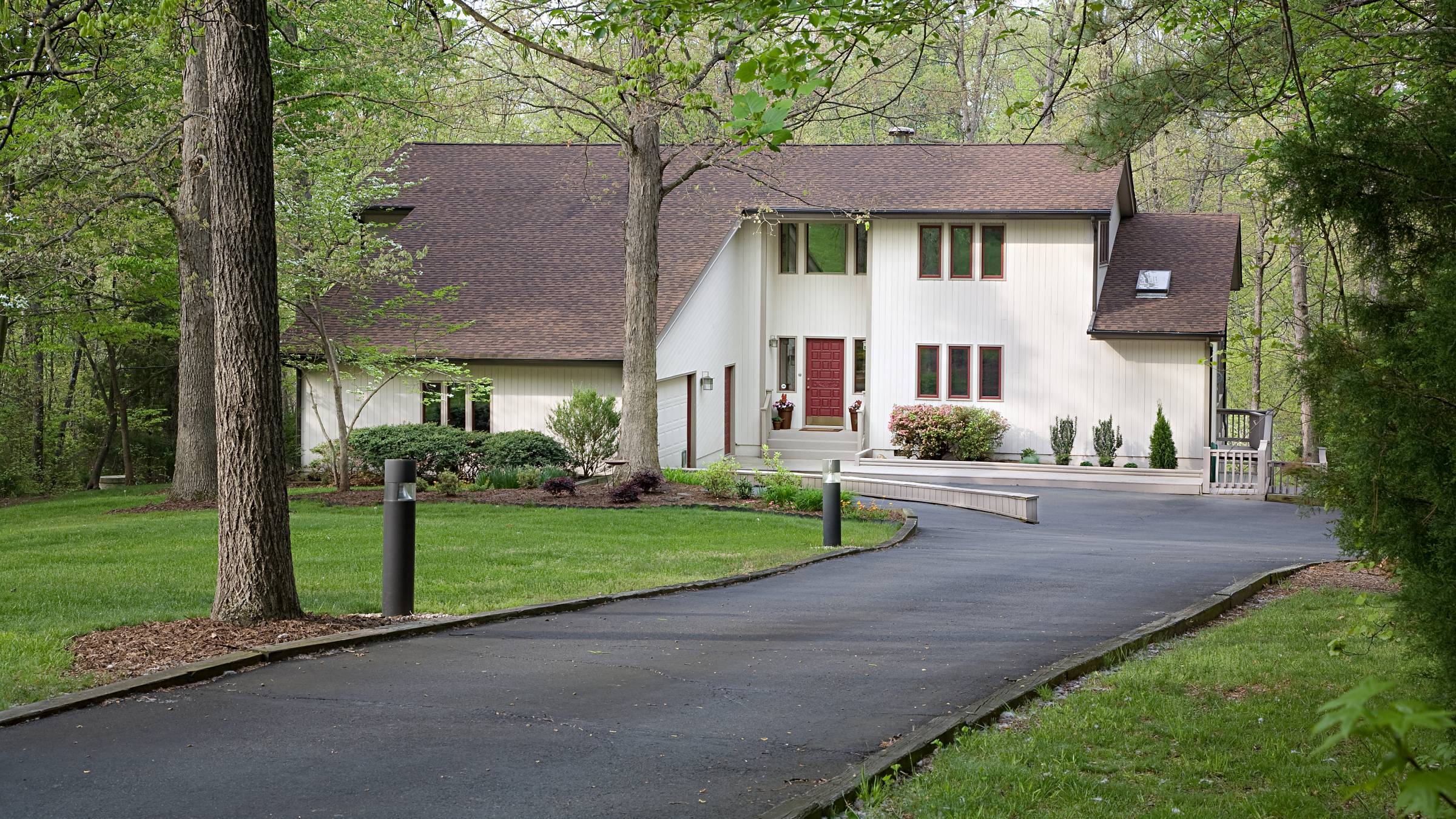 a private residence with a tarmac driveway