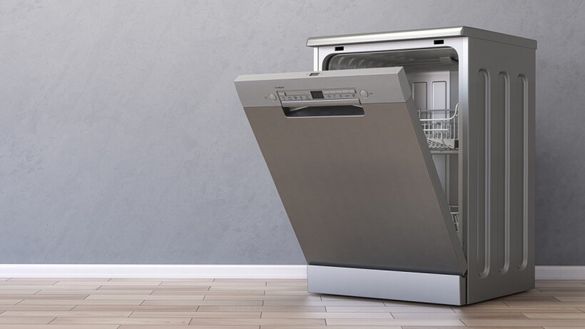 Integrated vs freestanding dishwasher: An open freestanding dishwasher in apartment