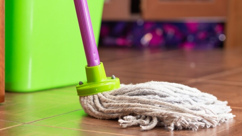 Steam mop, spin mop, or regular mop - a regular mop cleaning the floor 