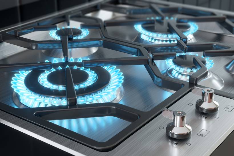 a close up photo of a gas hob - gas vs induction hob