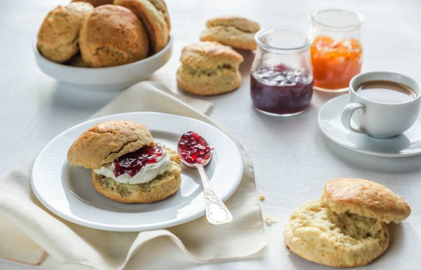 Devon vs Cornwall cream tea - scones with cream and fruit jam