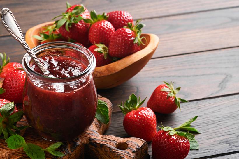 Devon vs Cornwall cream tea - fresh strawberry jam in a glass jar