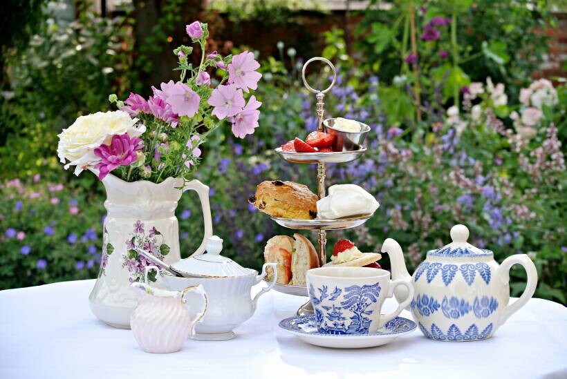 Devon vs Cornwall cream tea - cream tea setup in a country garden