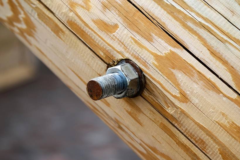 screw vs bolt - a bolt securing a wooden beam