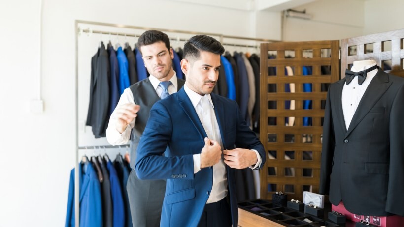 Made to measure vs bespoke - A client trying their made to measure suit with the help of a tailor