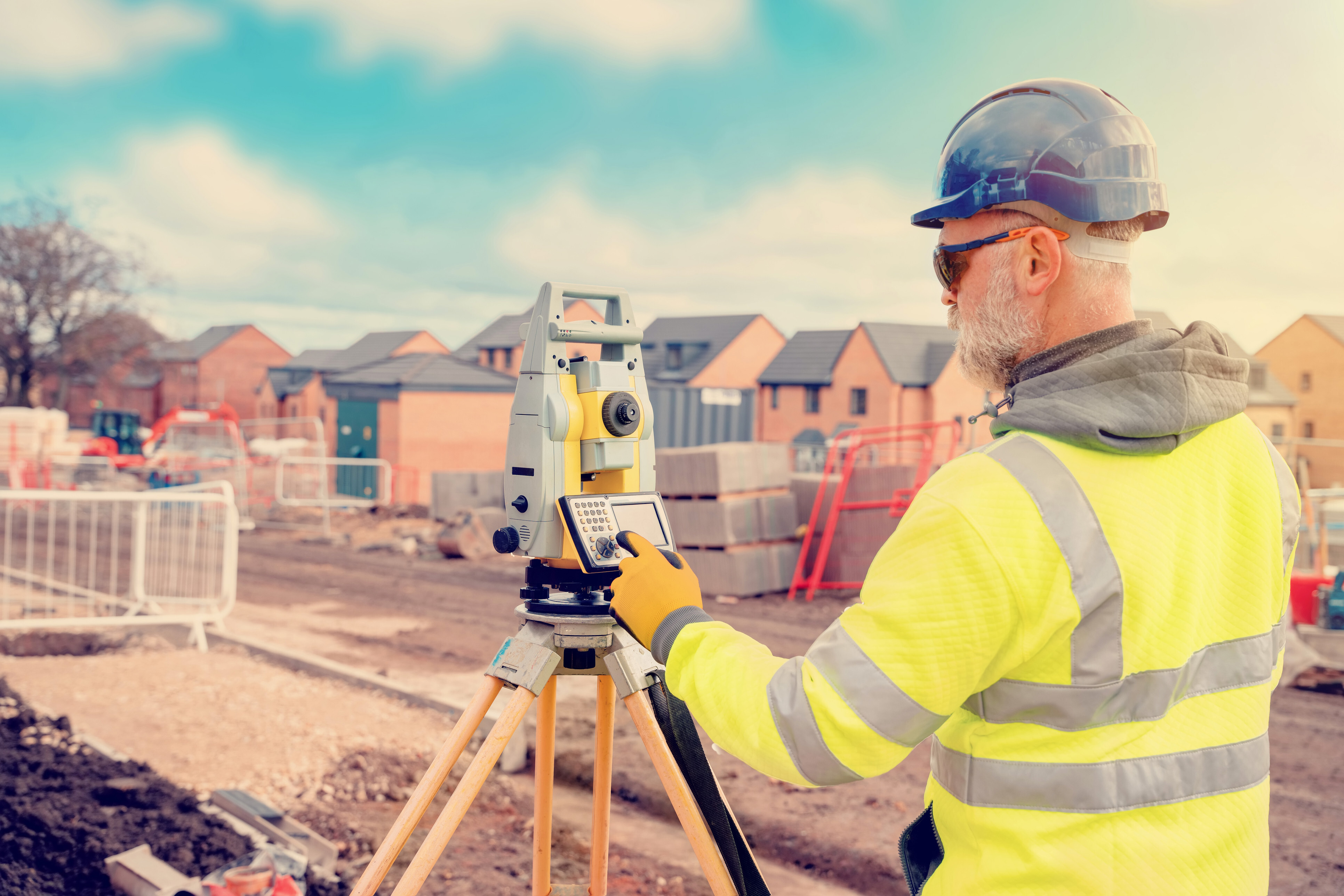 Building surveyor near me inspecting a construction site ensuring structural integrity and compliance with regulations.