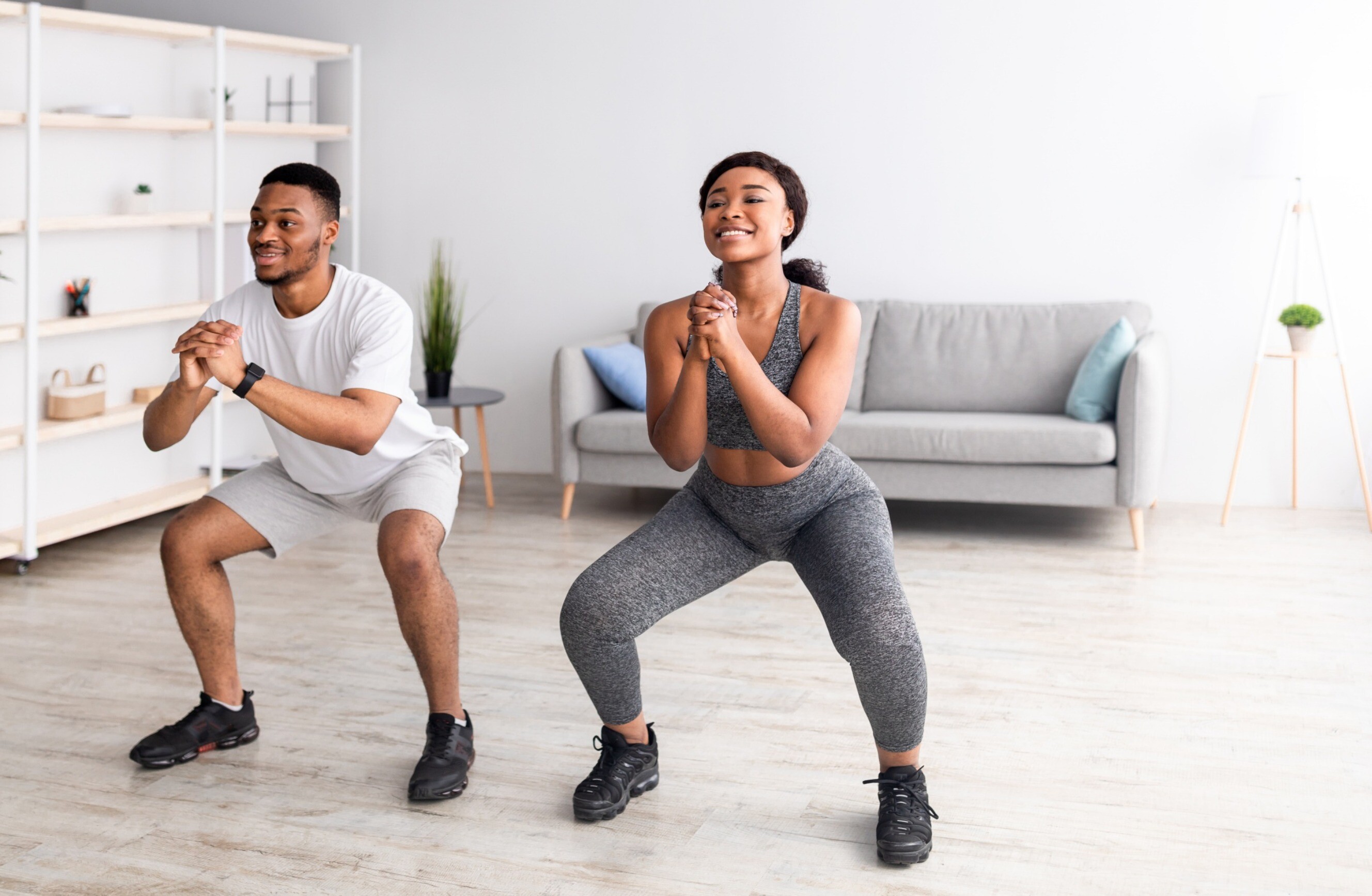 Two people engaging in an at-home workout session together