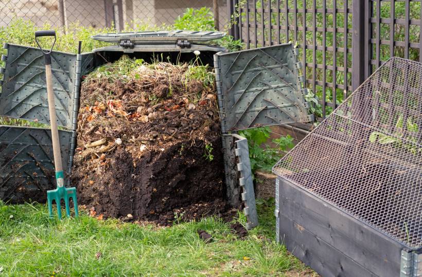 how to dispose of garden waste - a bin full of fresh compost