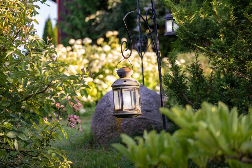 landscaping ideas for small gardens - a glass lamp in the middle of a garden