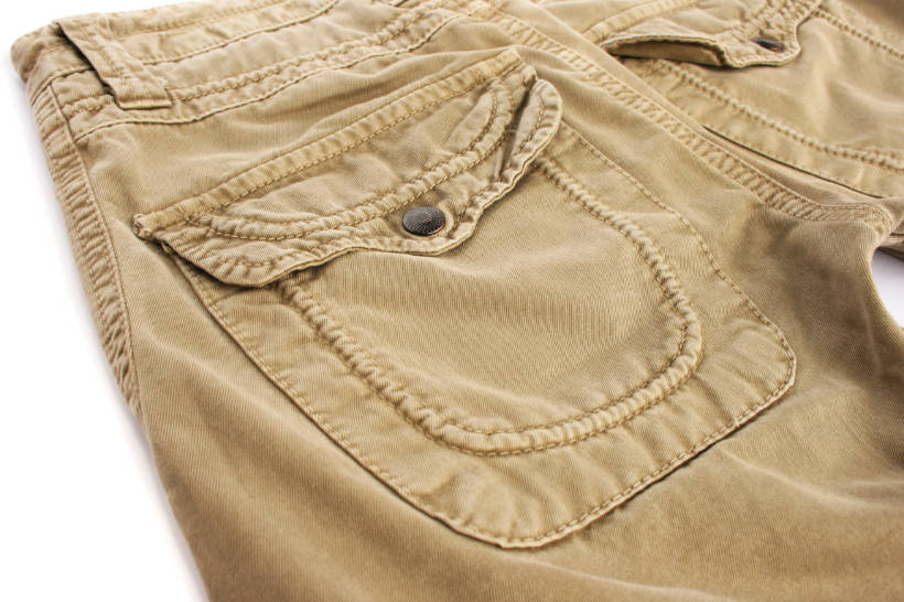 Chinos vs Khakis - ​​Close-up of khaki pants made from durable cotton fabric