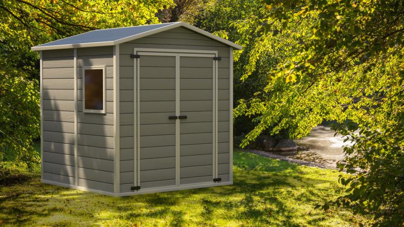 Outdoor shed in a garden, surrounded by greenery