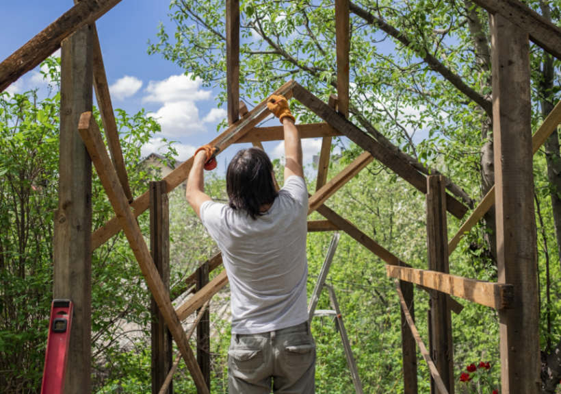 Metal vs wood shed — Constructing a durable wooden shed frame in a backyard