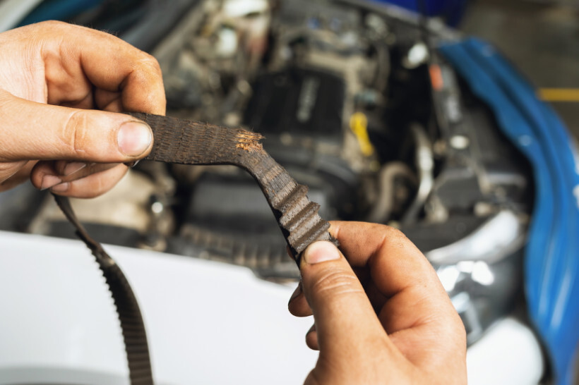 timing belt replacement cost - Close-up of a worn-down timing belt