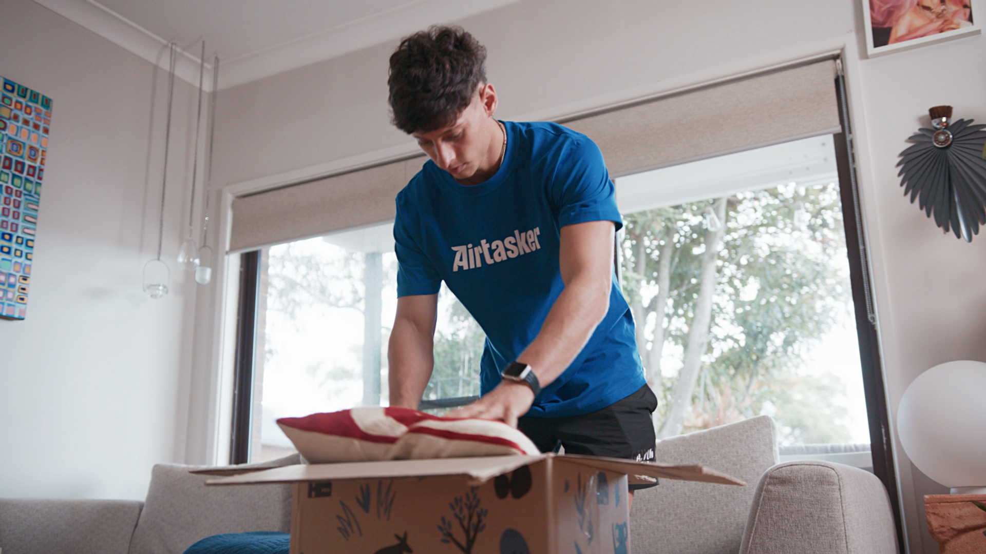 house removals cost - Interior scene showing an Airtasker professional managing a moving job